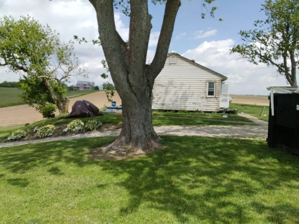 Aging roof and weathered exterior on a Central Ohio ranch home before roof replacement