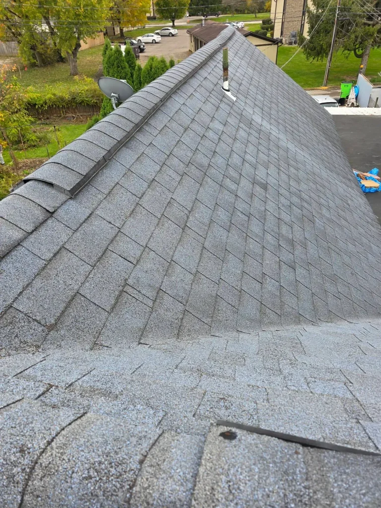 New shingles and ridge cap on a completed roof replacement in Central Ohio